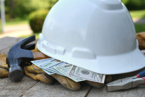 Contractor Markup hardhat, construction tools and money