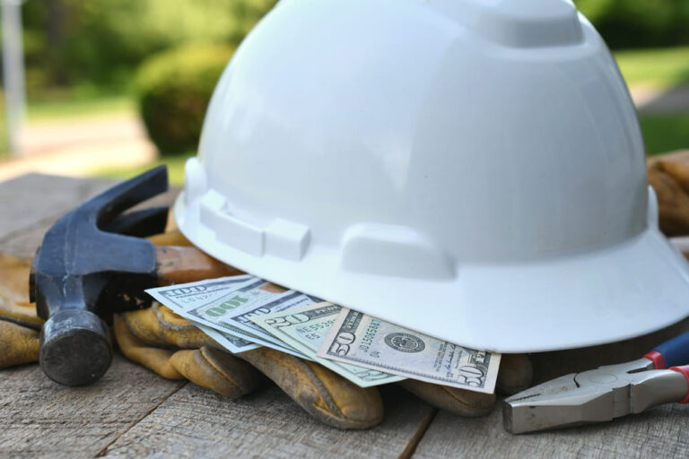 Contractor Markup hardhat, construction tools and money