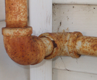 Rusty Pipes Cause Basement Water Leak Repair