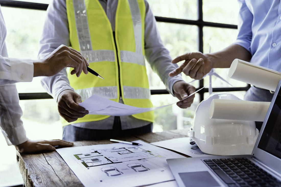Owners Guide Construction Project Management Project Managers reviewing drawings